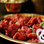 Crispy Kalan Mushroom 65 fried golden brown and garnished with spicy herbs and curry leaves.